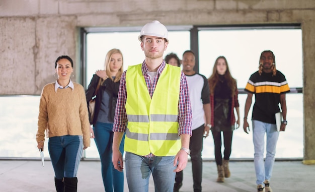 happy multiethnic business team walking through unfinished startup office moving new building 530697 14196